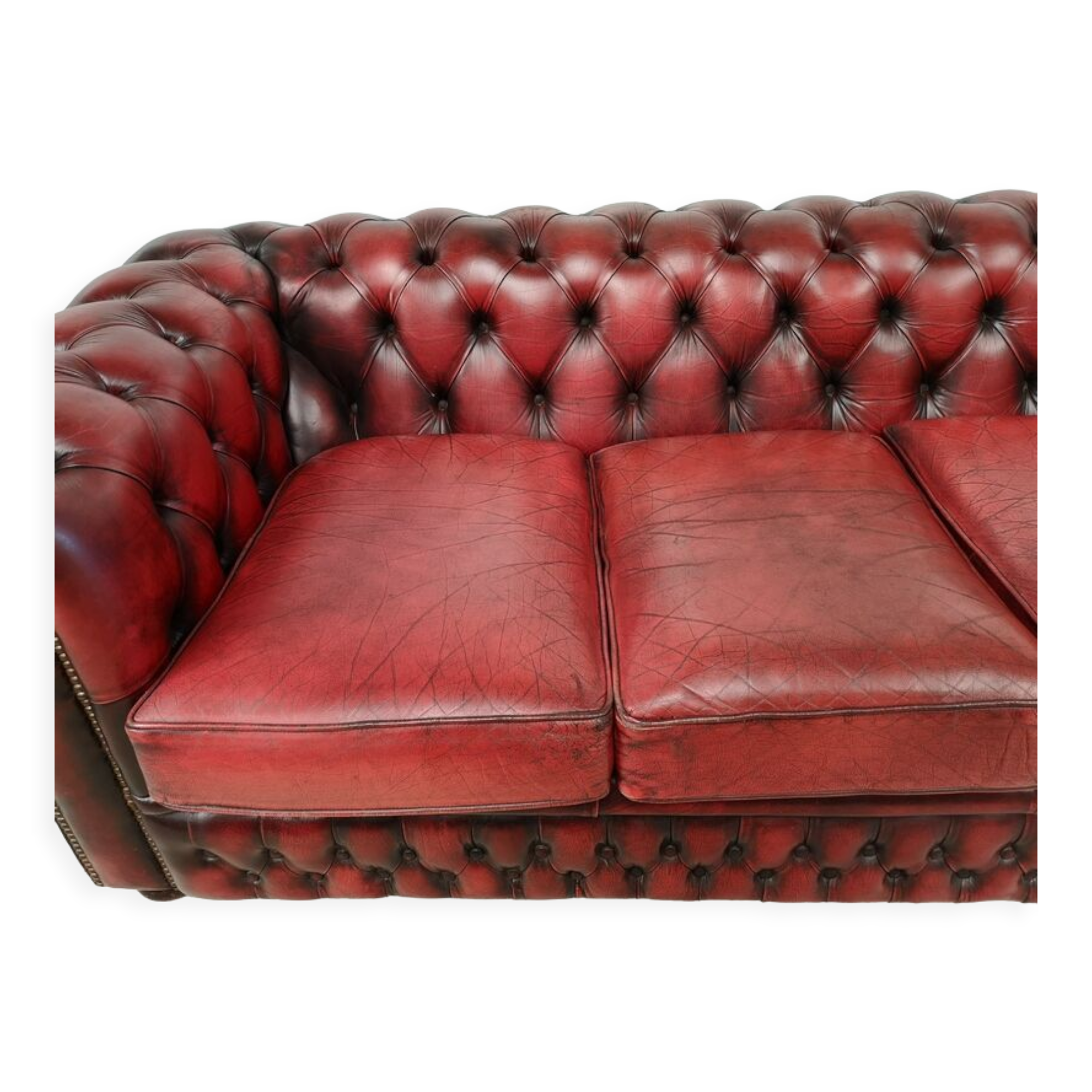 Three-seater red leather chesterfield sofa