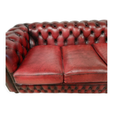 Three-seater red leather chesterfield sofa