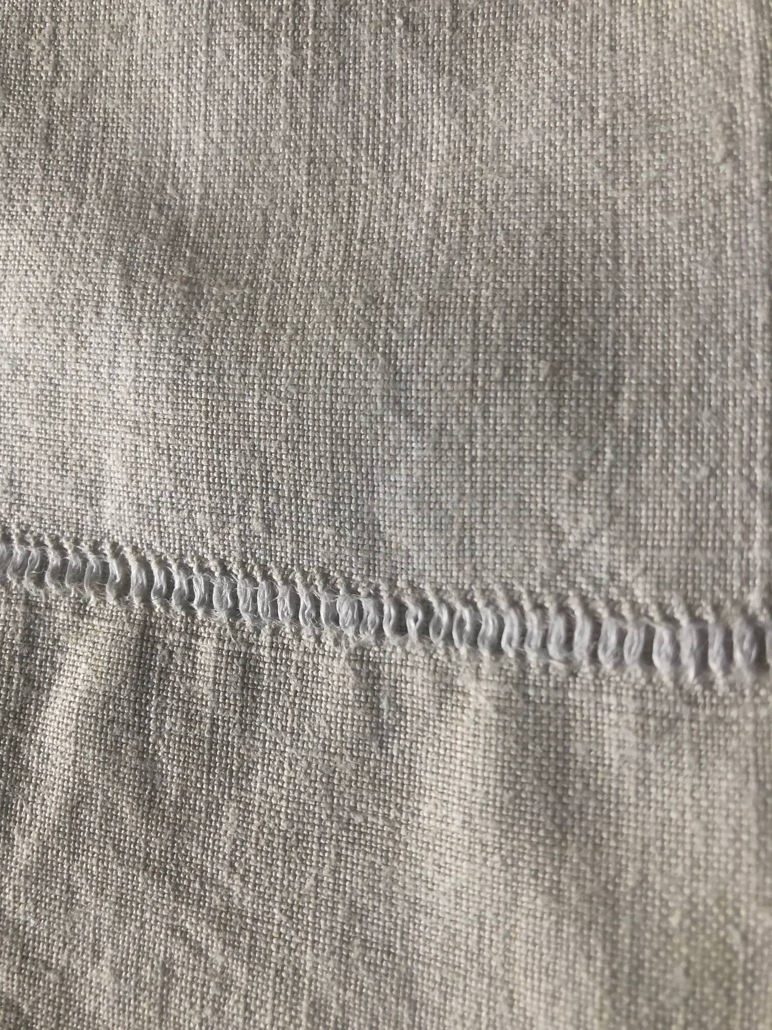 Antique linen sheet with monogram VI