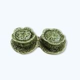 Salt and pepper shakers in the shape of a cabbage leaf.