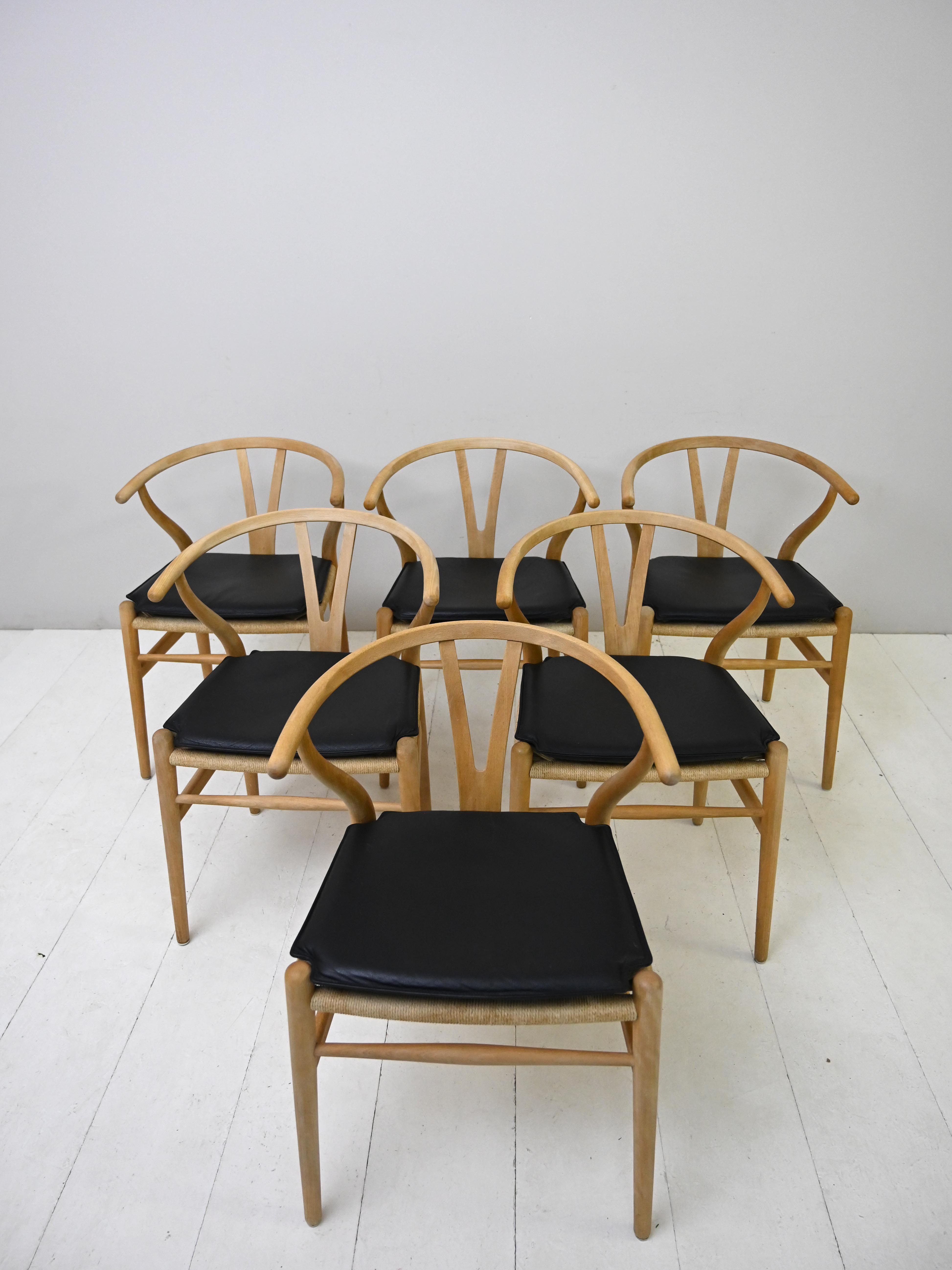 Set of six 'Wishbone chair' model chairs by Hans J. Wegner with leather cushions