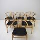 Set of six 'Wishbone chair' model chairs by Hans J. Wegner with leather cushions