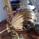 Articulated shell lamp in gold metal