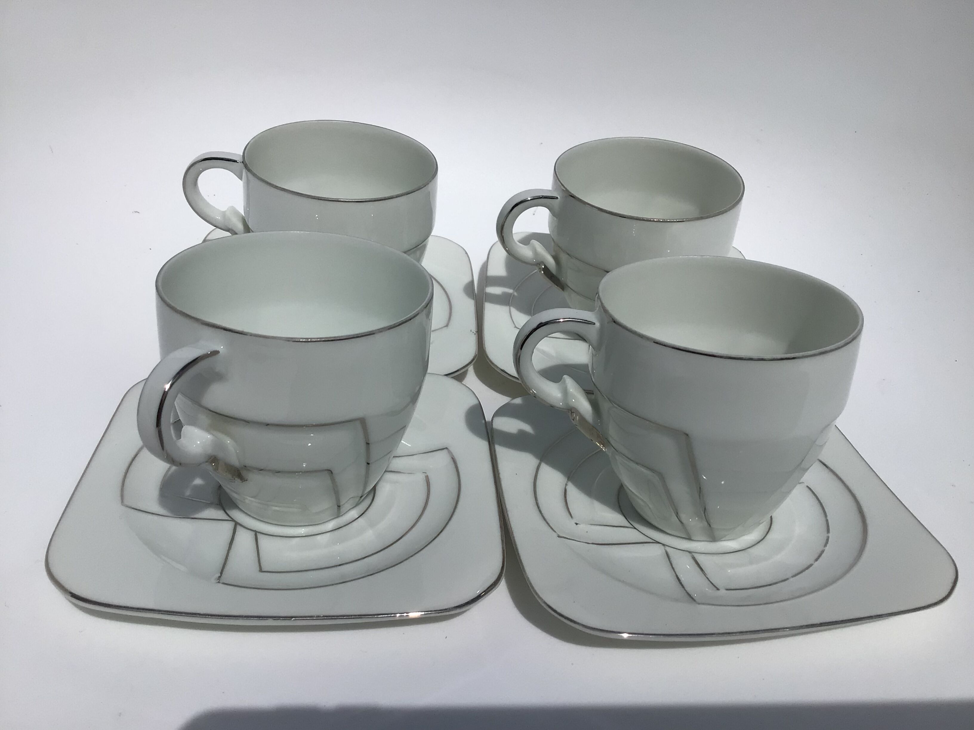 4 fine porcelain cups art deco silver thread