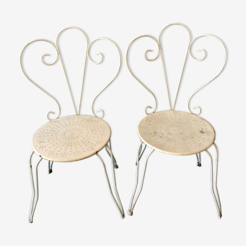 Duo of wrought iron garden chairs