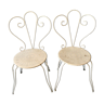 Duo of wrought iron garden chairs