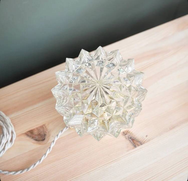 Table lamp with cut glass in the shape of a star.