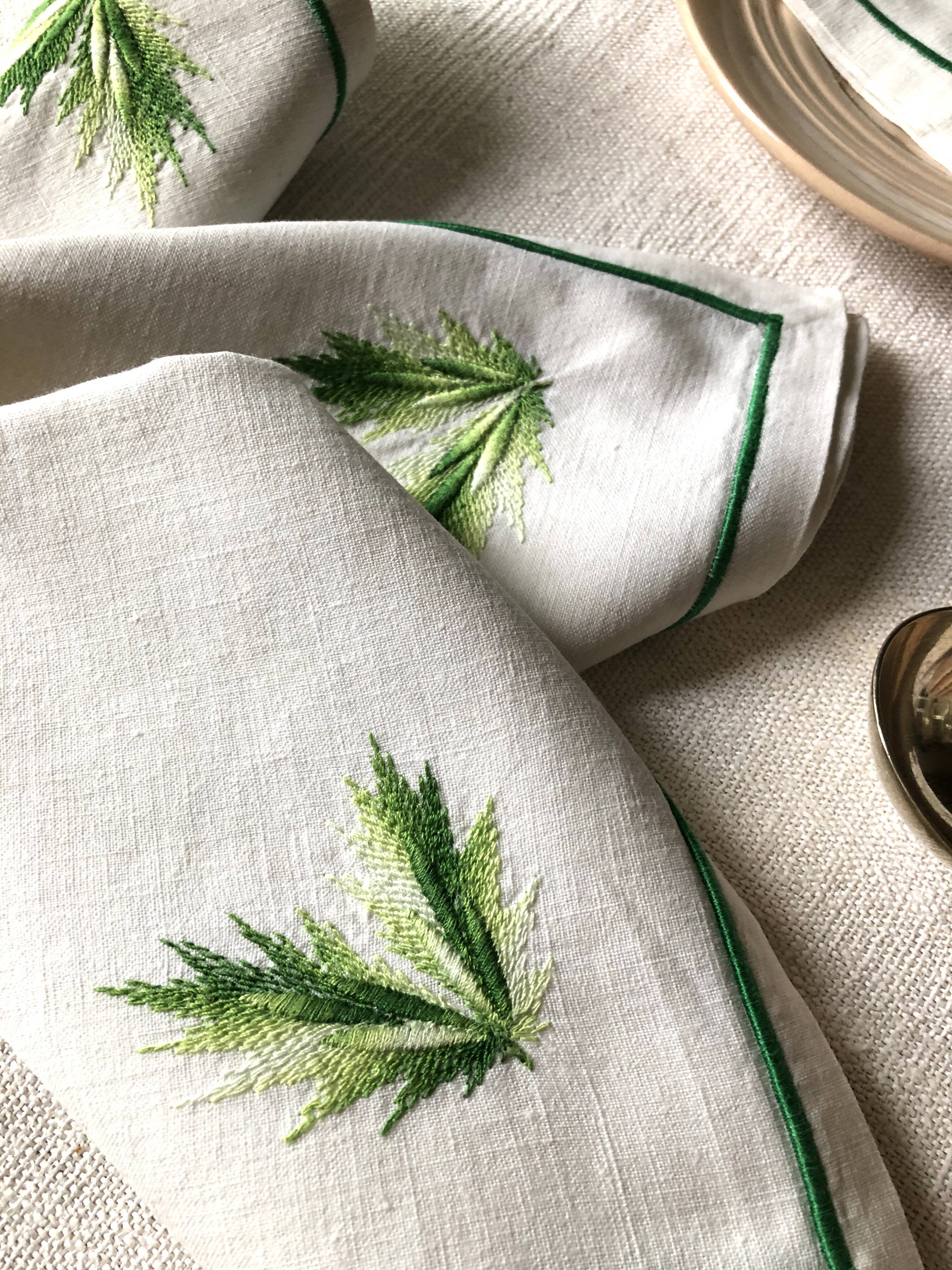 Series of four embroidered linen napkins