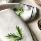 Series of four embroidered linen napkins