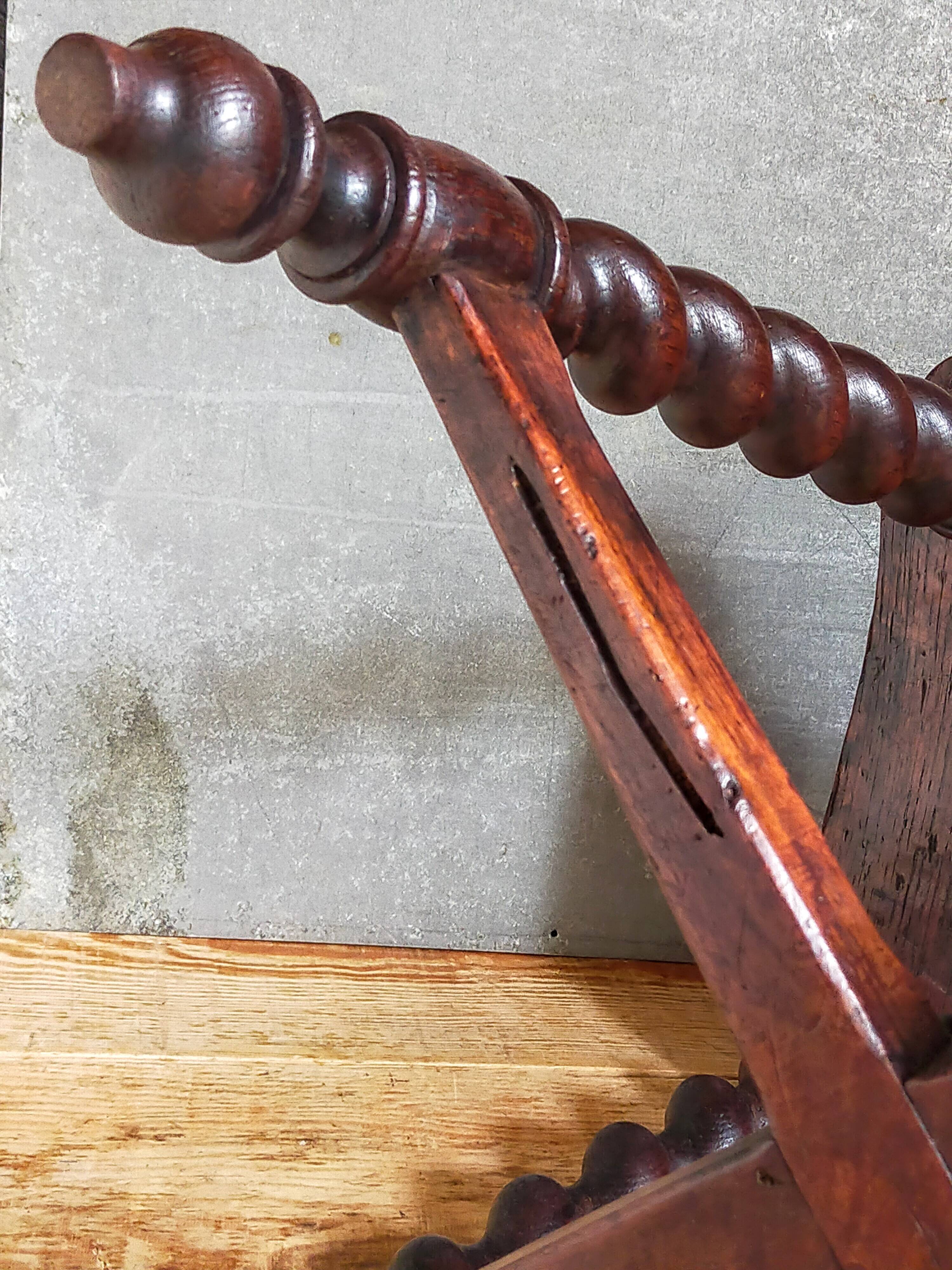 Antique stool in turned and carved solid wood