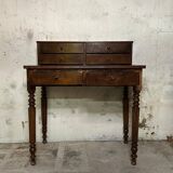 Wooden lady's desk says "happiness of the day"