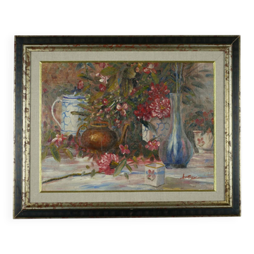 Still life with pink flowers and blue pots.