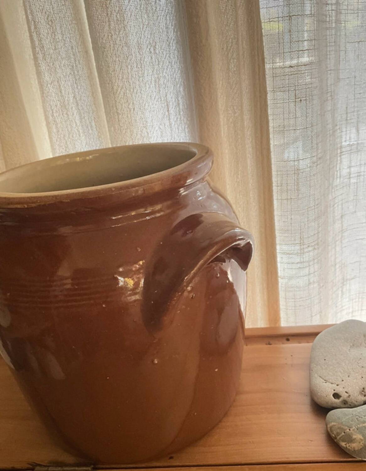 Ancient ceramic salt cellar and its lid.
