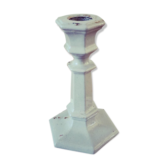 Old enamelled cast iron candlestick