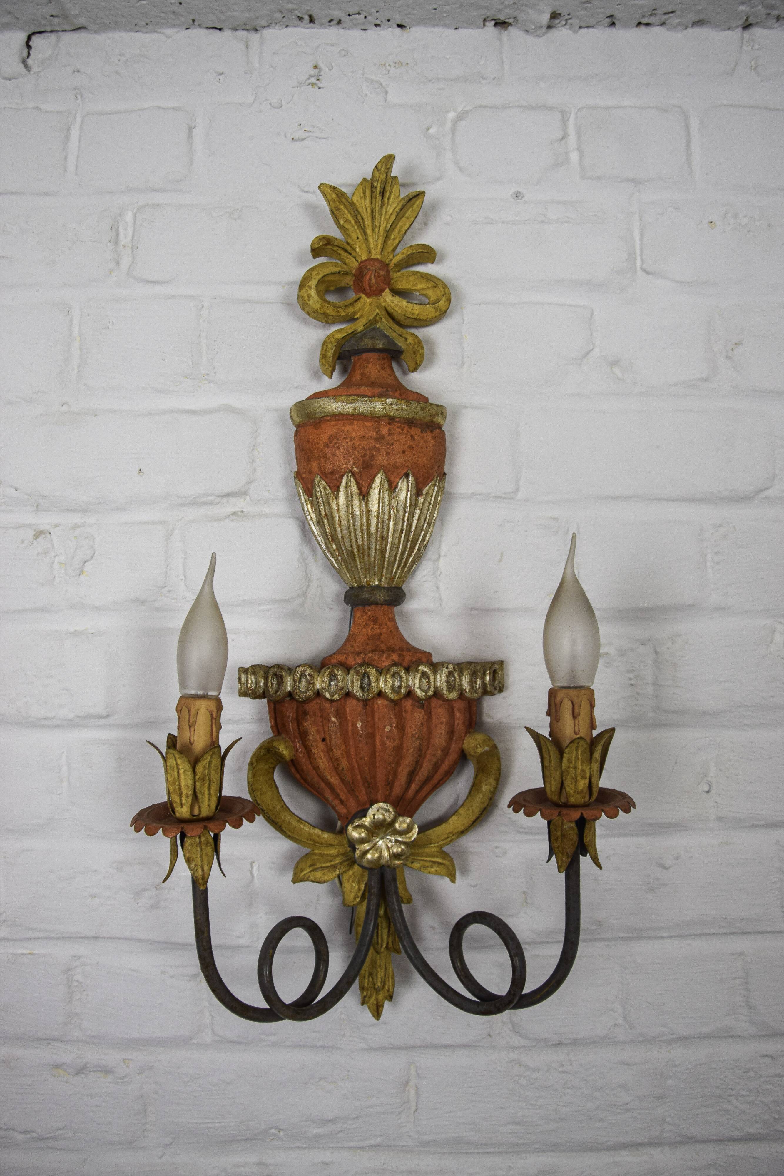 Pair of patinated wood sconces