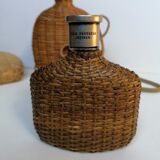 Trio of woven wicker bottles