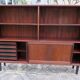 Low rosewood library with sliding doors and drawers, Denmark 1960.