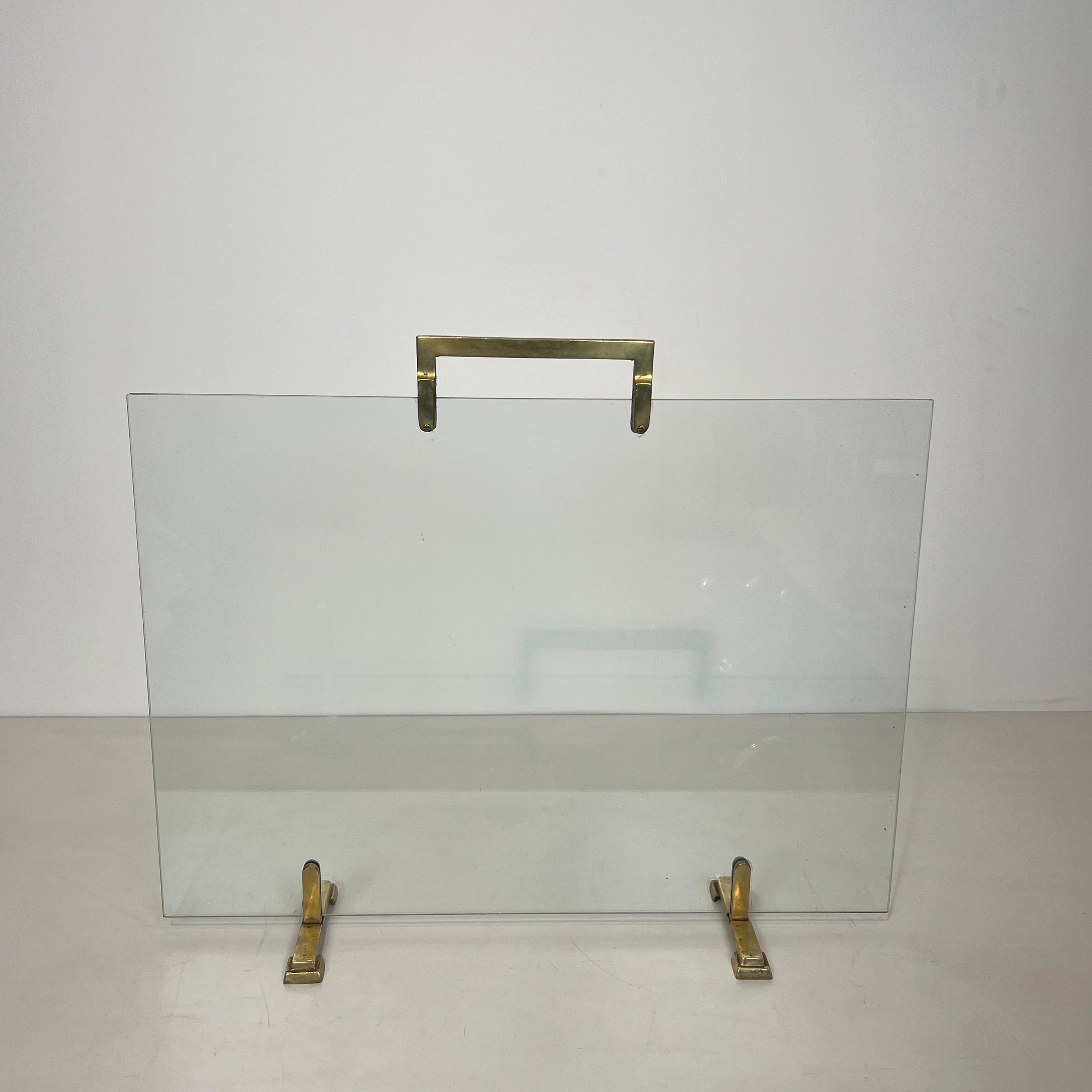 Glass and brass fire screen