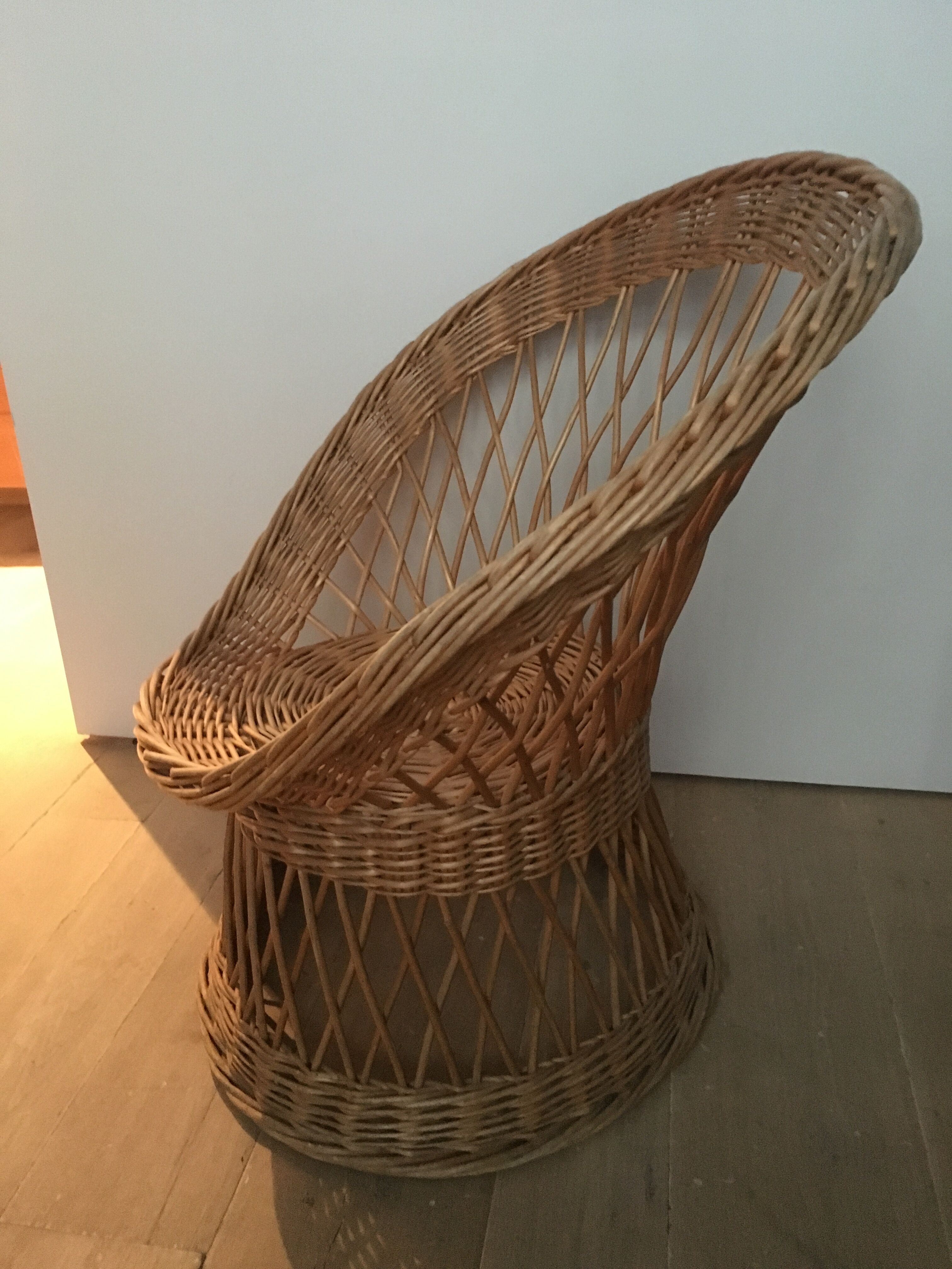 Armchair in rattan basket