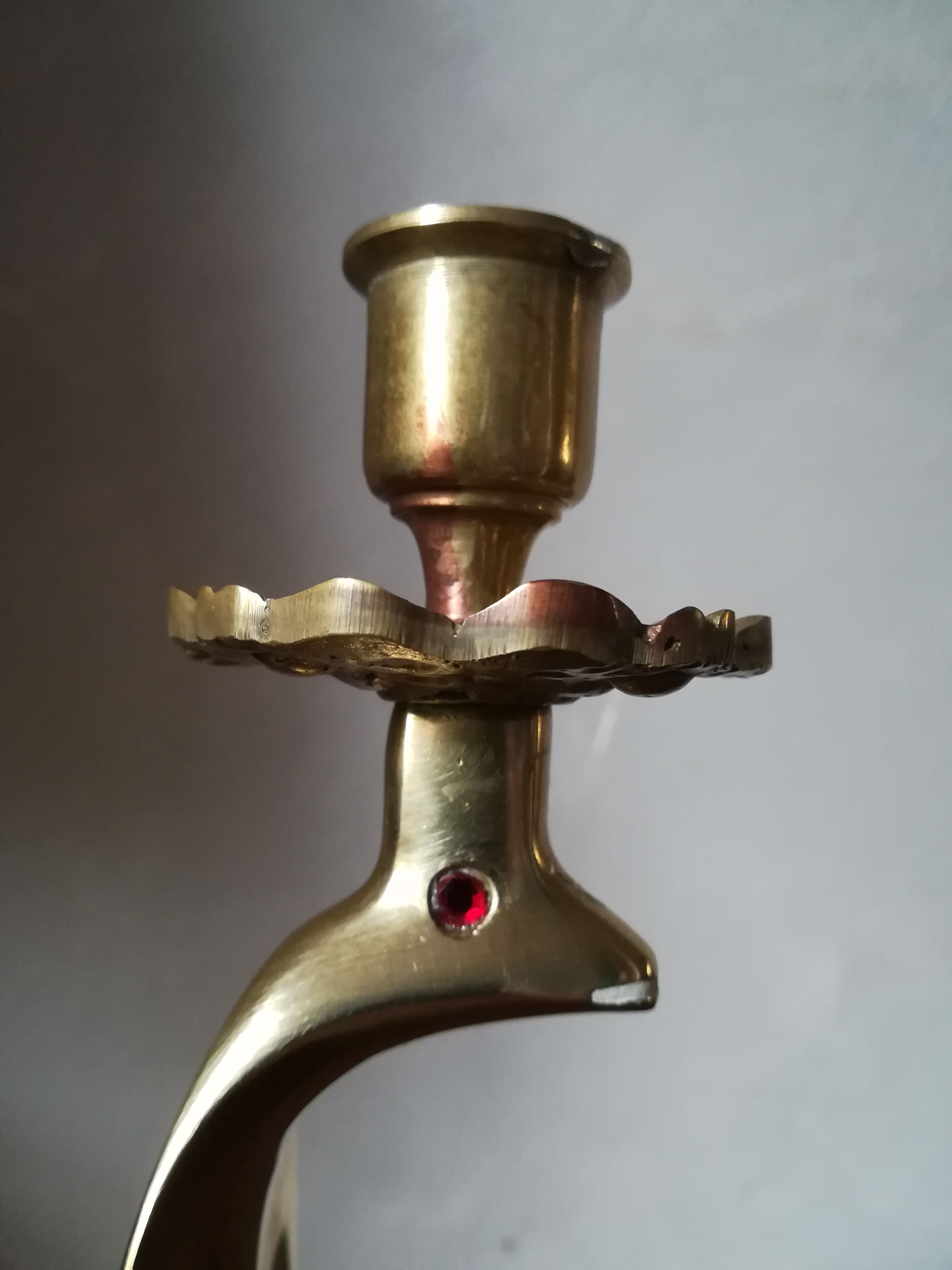 Candlestick mounted on brass cobra