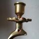 Candlestick mounted on brass cobra