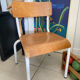 Old wooden and metal children's school chair
