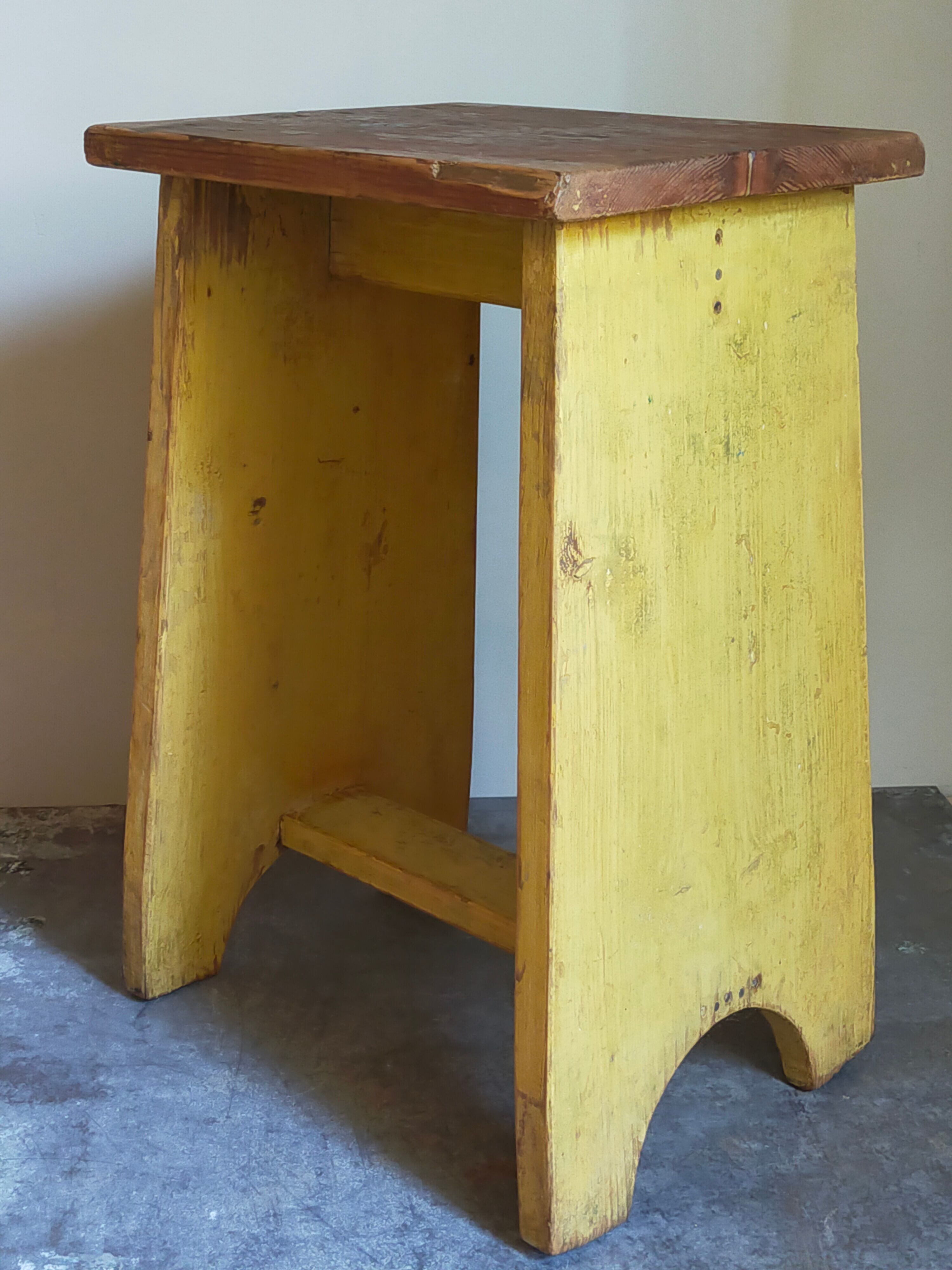Art-populaire workshop stool in patinated painted wood