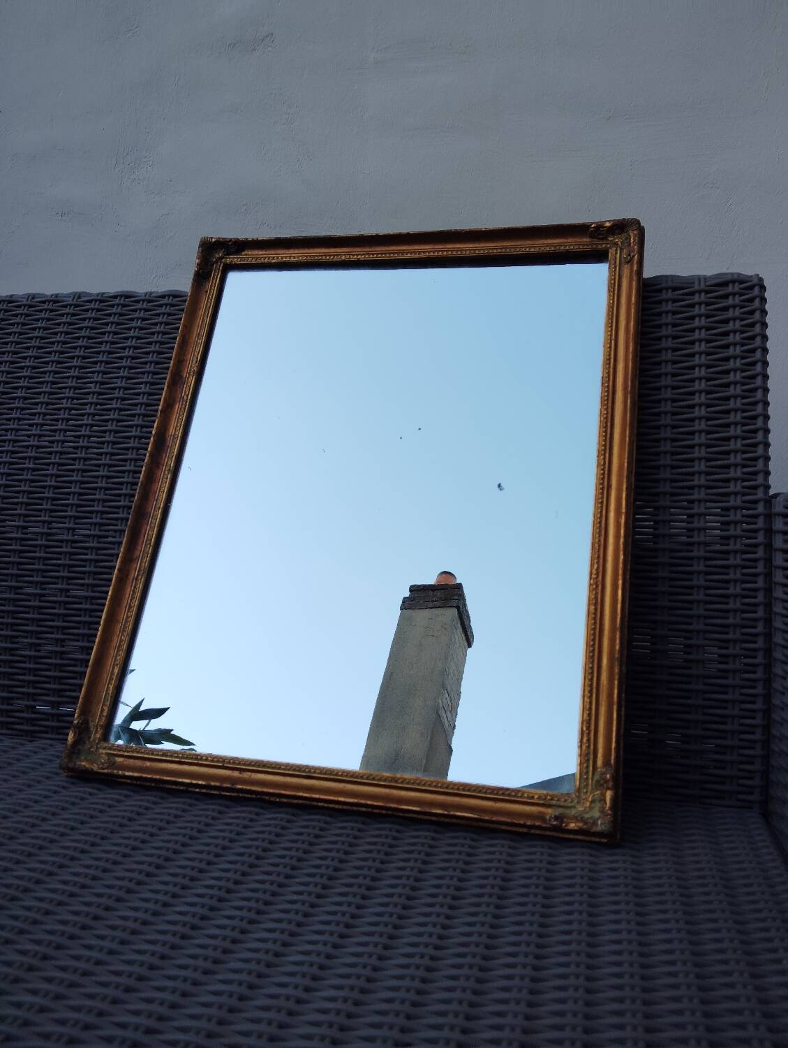 Miroir en bois, doré à la feuille d'or.