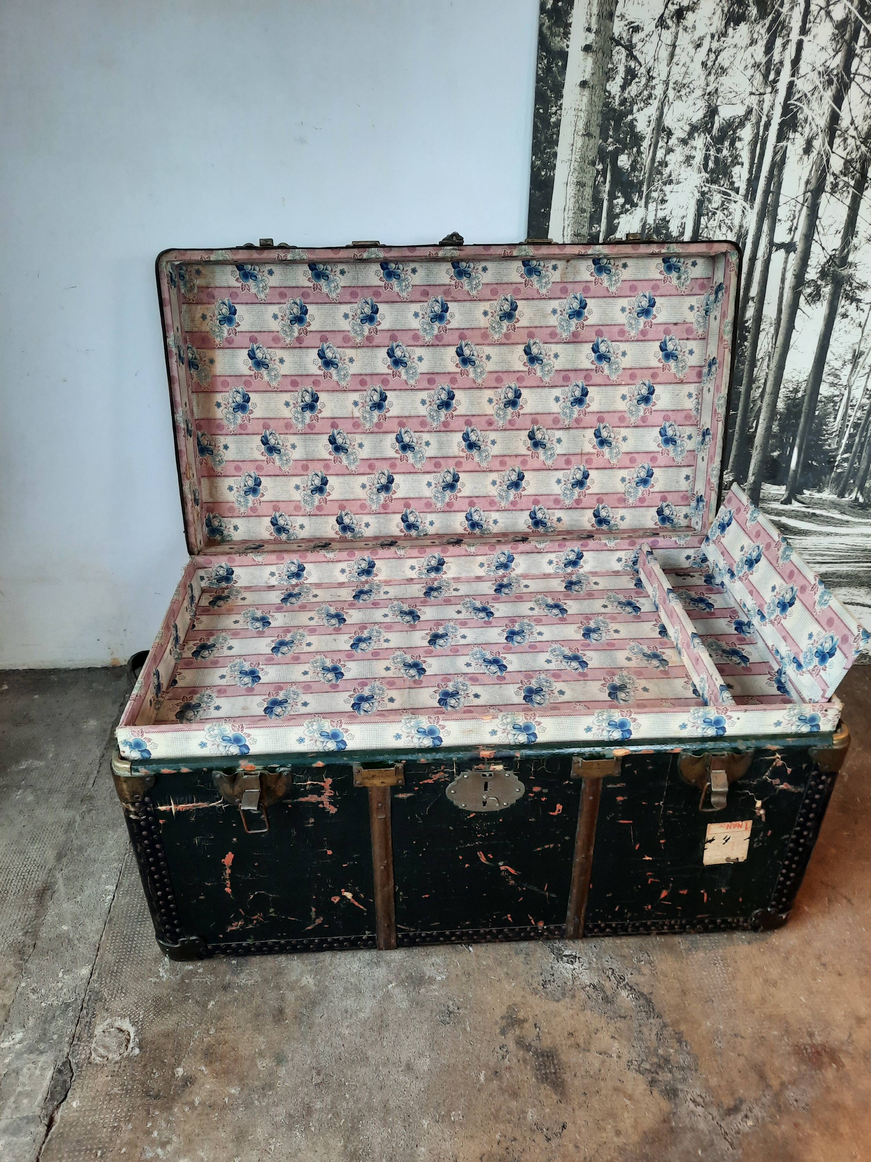 Old and large travel trunk, brass-plated corners