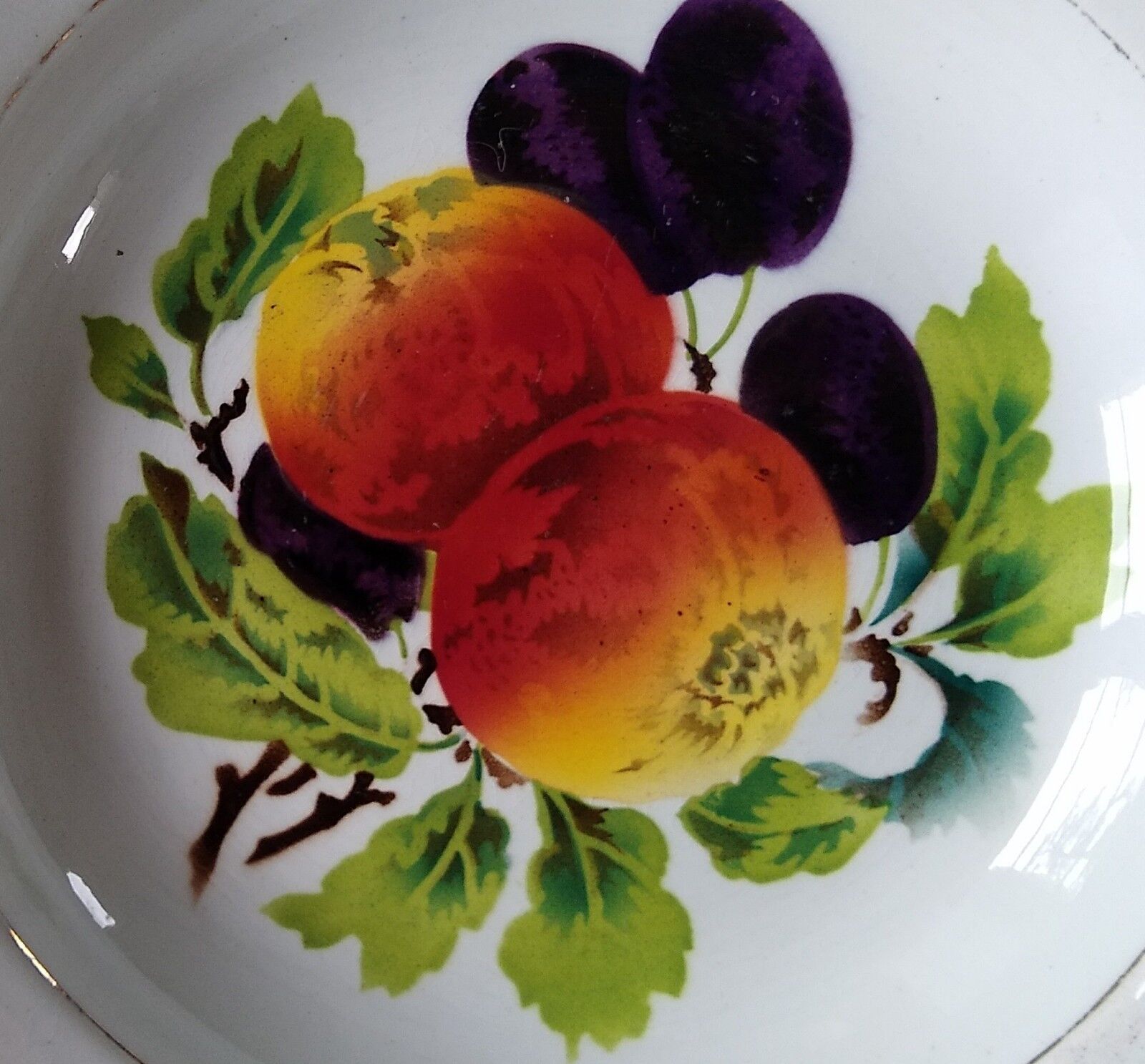 Round dish in Earthenware St Amand decorated with fruit apples and plums