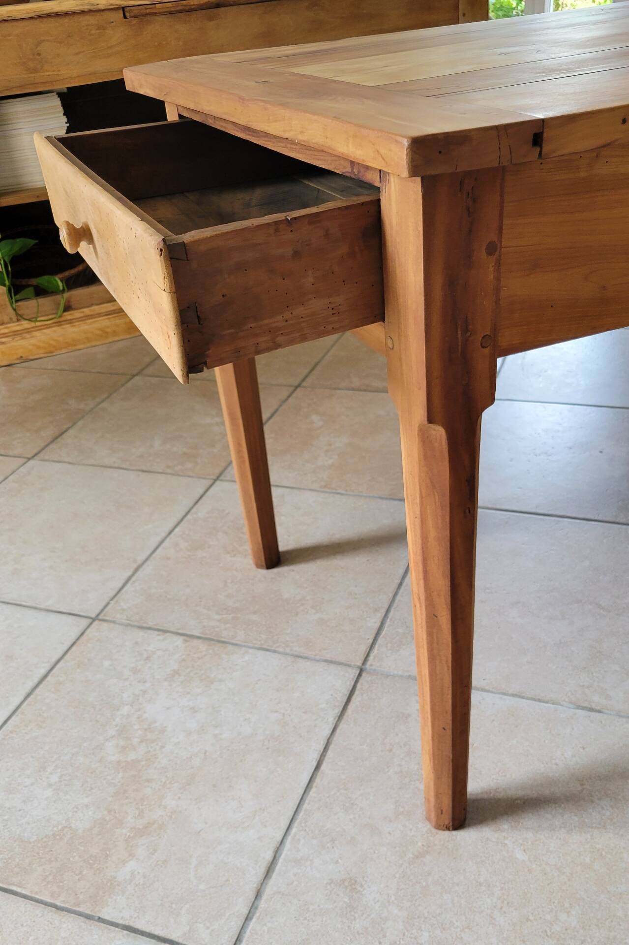 Old farmhouse table made of solid walnut wood.