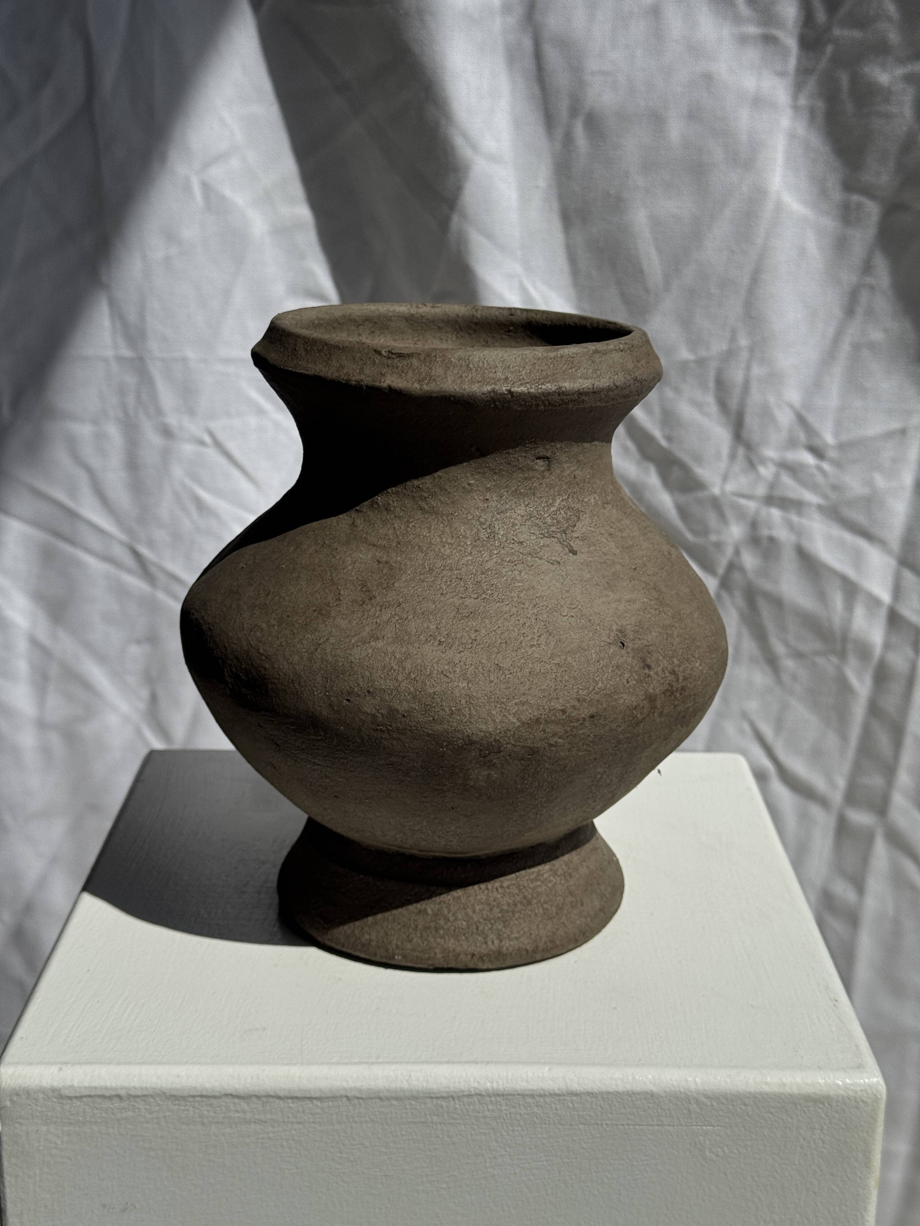 Small brutalist handcrafted terracotta vase with a pedestal, Indonesian, H19 D17.