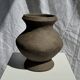 Small brutalist handcrafted terracotta vase with a pedestal, Indonesian, H19 D17.