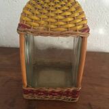 Bottle sheathed on the top and the low d wicker woven