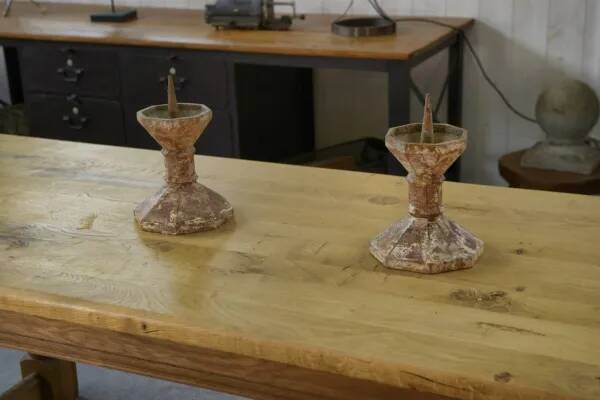 Pair of patinated cast iron candlesticks, 1940s