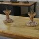 Pair of patinated cast iron candlesticks, 1940s