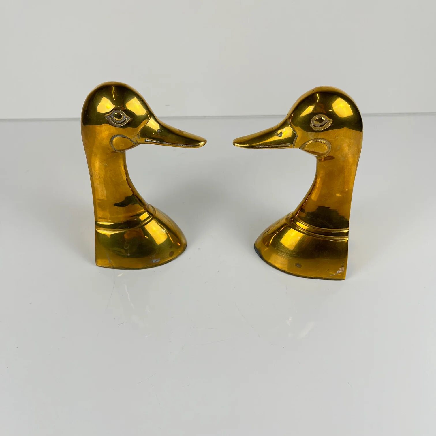 Pair of brass bookends in the shape of a duck's head, 1970.