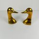 Pair of brass bookends in the shape of a duck's head, 1970.