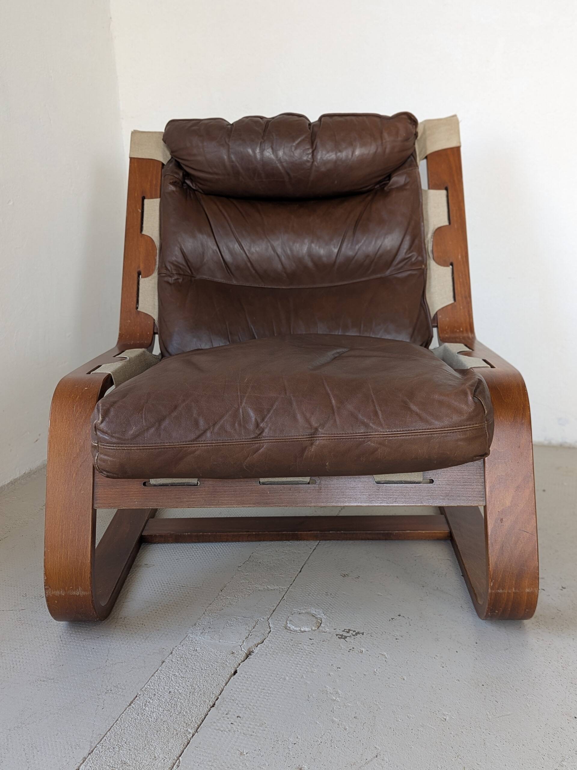 Leather and wood armchair, brutalist style.