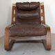 Leather and wood armchair, brutalist style.