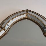 Mirror consisting of multi-faceted mirrors and brass garlands, French work, around 1970