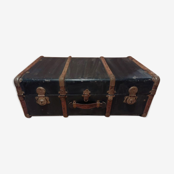 Old black wooden trunk with reinforcements