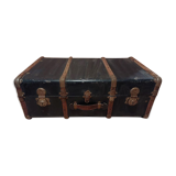 Old black wooden trunk with reinforcements