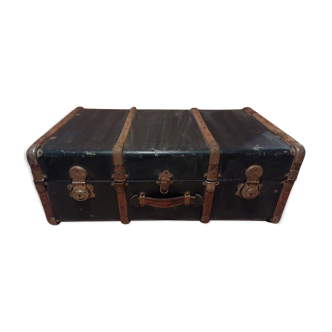 Old black wooden trunk with reinforcements