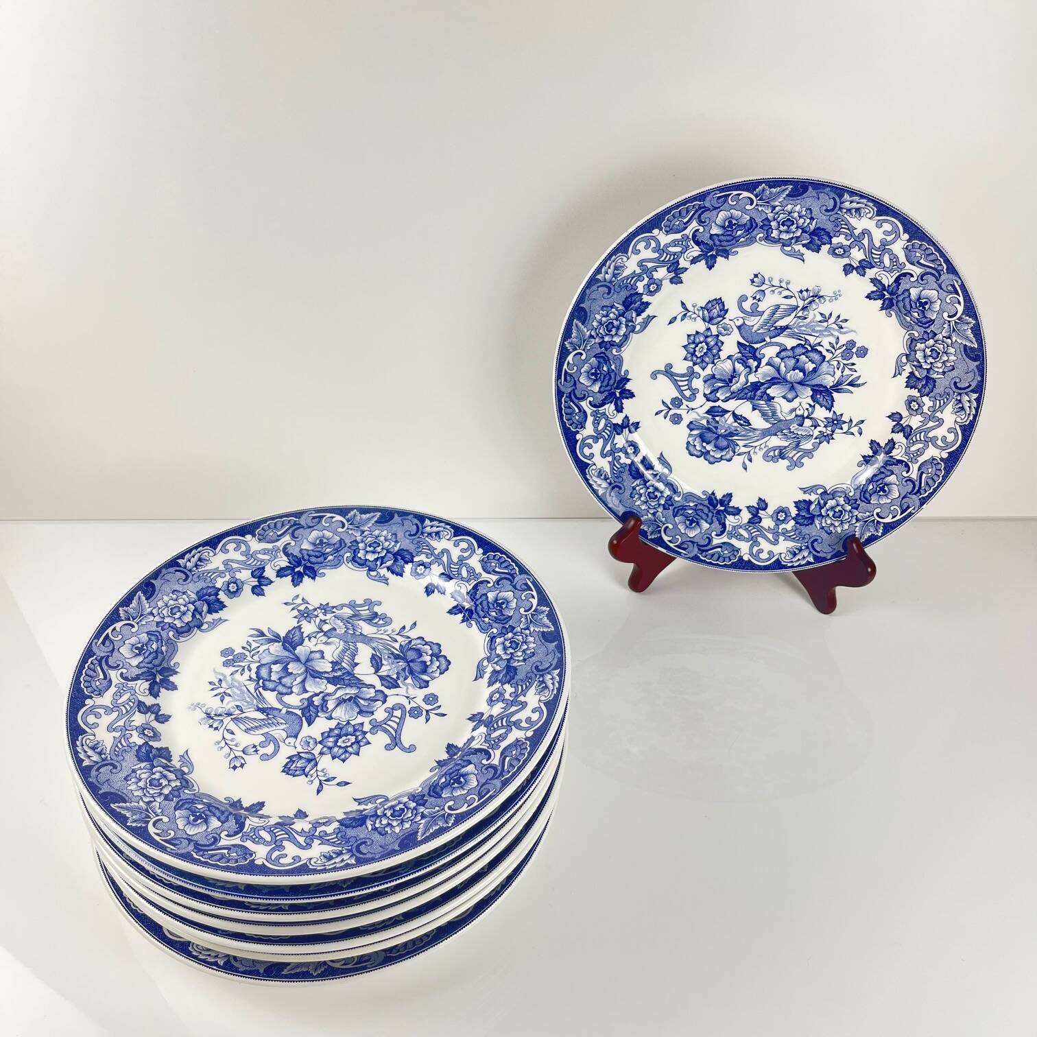 Set of 8 blue earthenware dinner plates with floral and bird decoration, 20th century