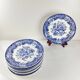 Set de 8 assiettes plates en faïence bleue, décor floral et oiseaux, XXe