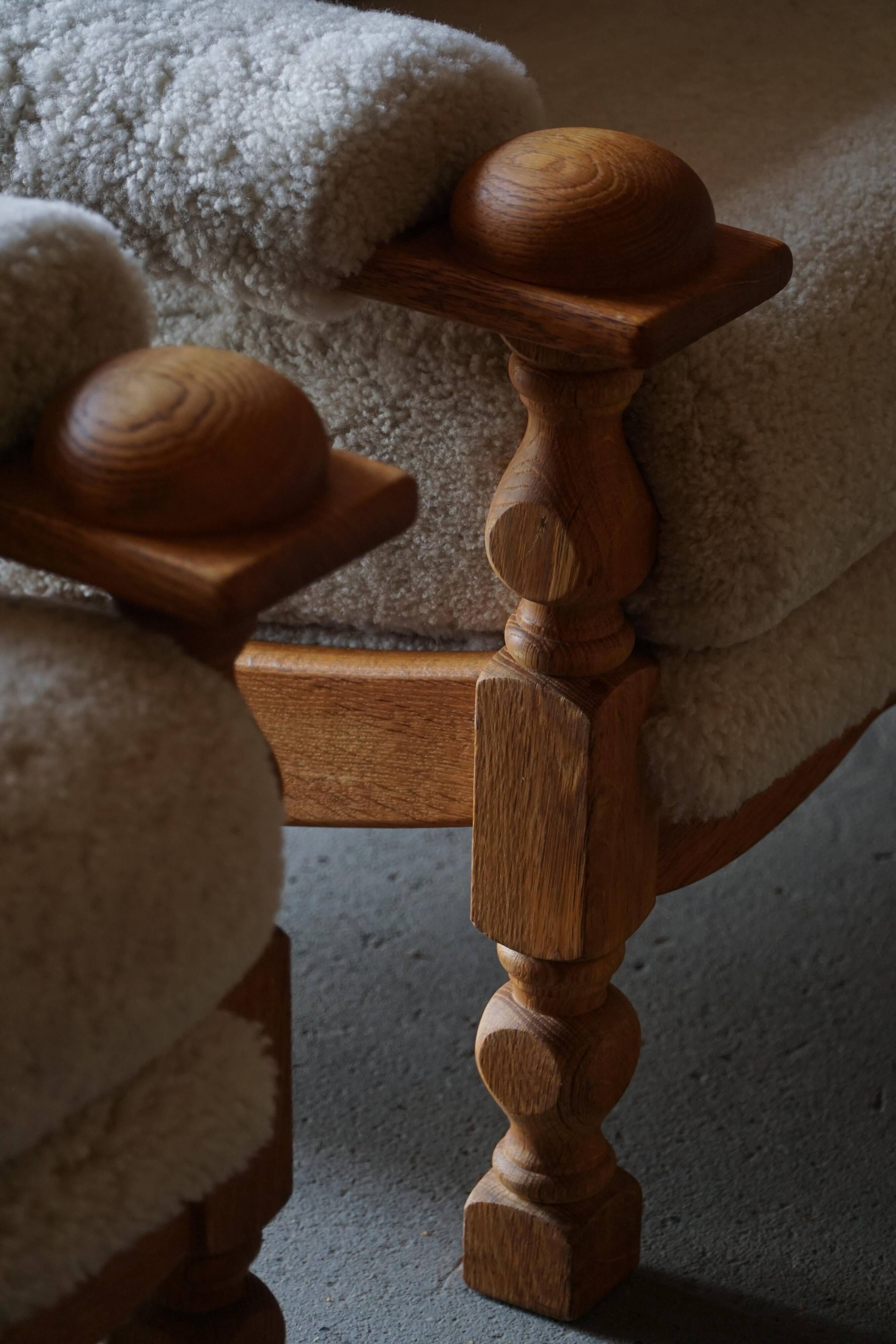 Henning Kjærnulf, lounge chairs in oak and lambswool, mid-century Danish, 1960s.