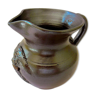 Norman sandstone pitcher with vegetal decoration