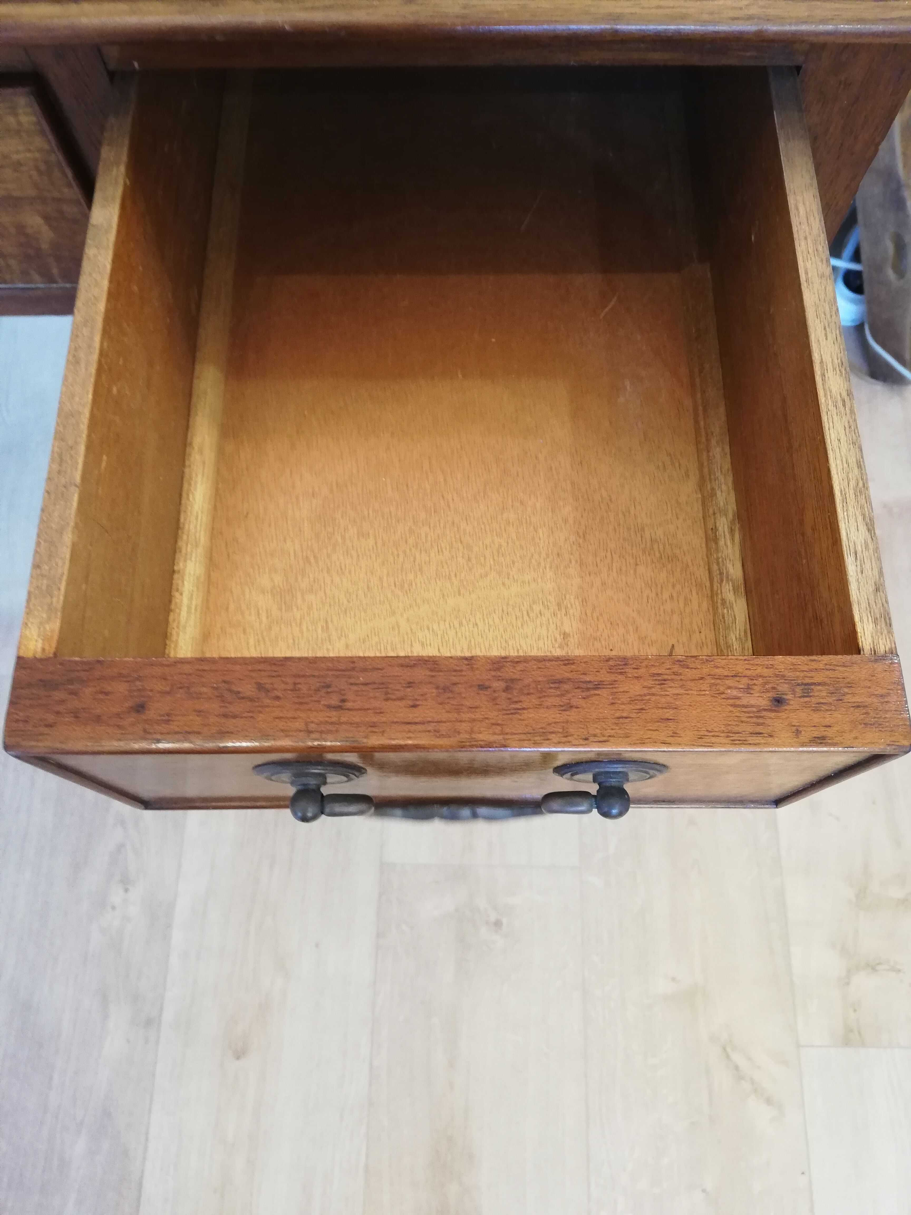 English wooden desk on top of leather