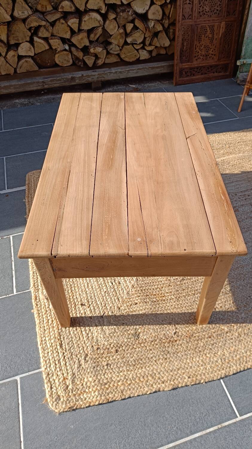 Low farmhouse table in raw wood